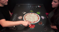 La chaîne de pizzerias Pizza Hut a récemment dévoilé un concept « phygital«  qui va en faire saliver plus d’un. Vidéo :